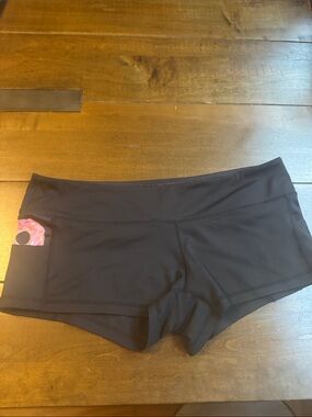 Feed Me Fight Me Black Bike Shorts with Pink Pocket Accent